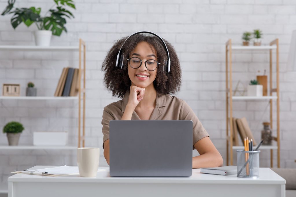Remote Speech Therapist Looking At Laptop